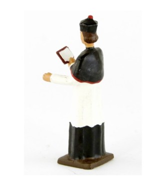 Chanoine portant la barette avec missel