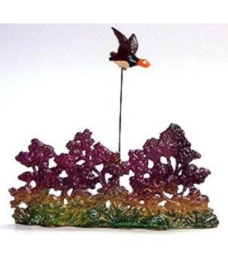 Buisson avec canard en vol