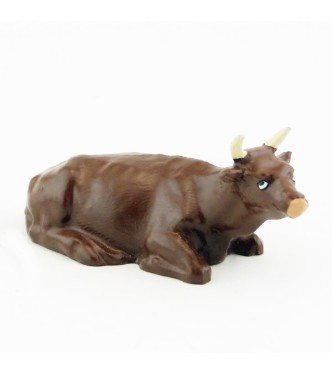 Vache marron (alezan) couchée