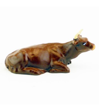 Vache marron (alezan) couchée