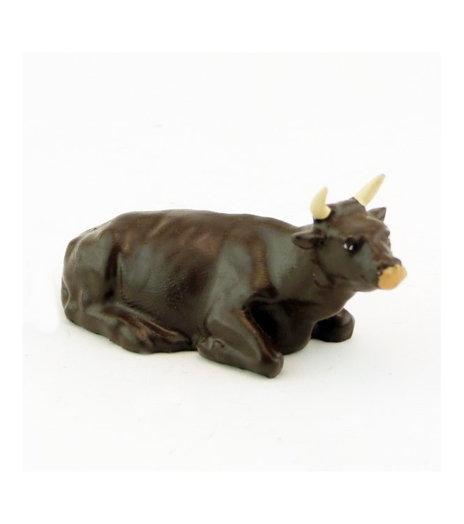 Vache marron couchée
