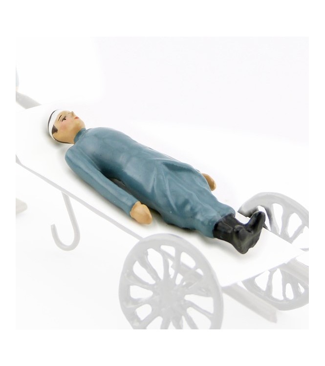 Soldat allongé en capote B. H., bandage à la tête (pour Side-Car ou Brancard)