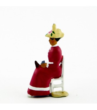 Femme assise en Rose violine crème