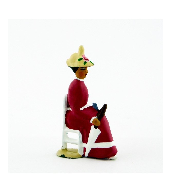 Femme assise en Rose violine crème