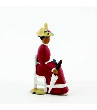 Femme assise en Rose violine crème