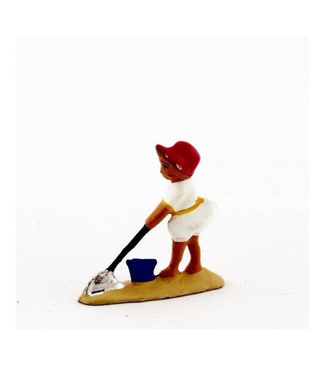 Petite fille   pelle en blanc