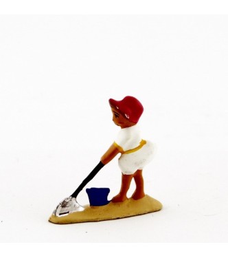 Petite fille   pelle en blanc