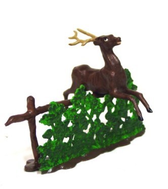 Cerf sautant une haie
