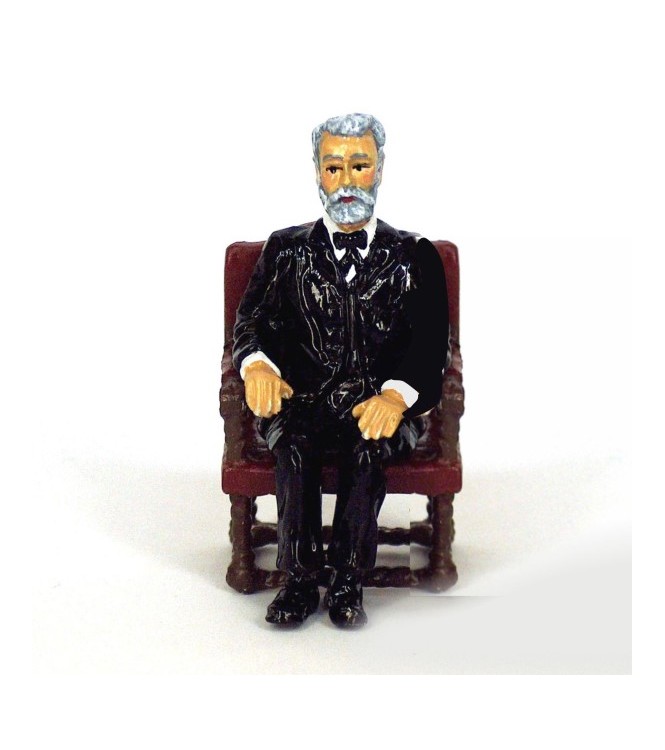 Jules Verne assis dans son fauteuil