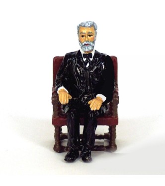 Jules Verne assis dans son fauteuil