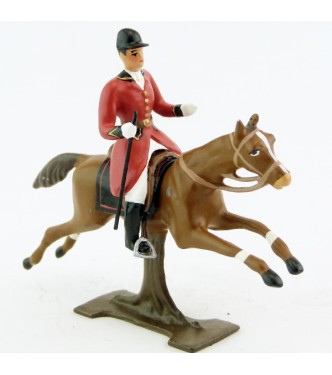 cavalier avec cravache sur cheval alezan au galop (sur tronc)