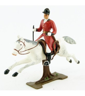 cavalier avec cravache sur cheval blanc au galop (sur tronc)