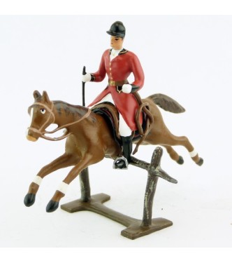 cavalier avec cravache sur cheval alezan sautant barrière