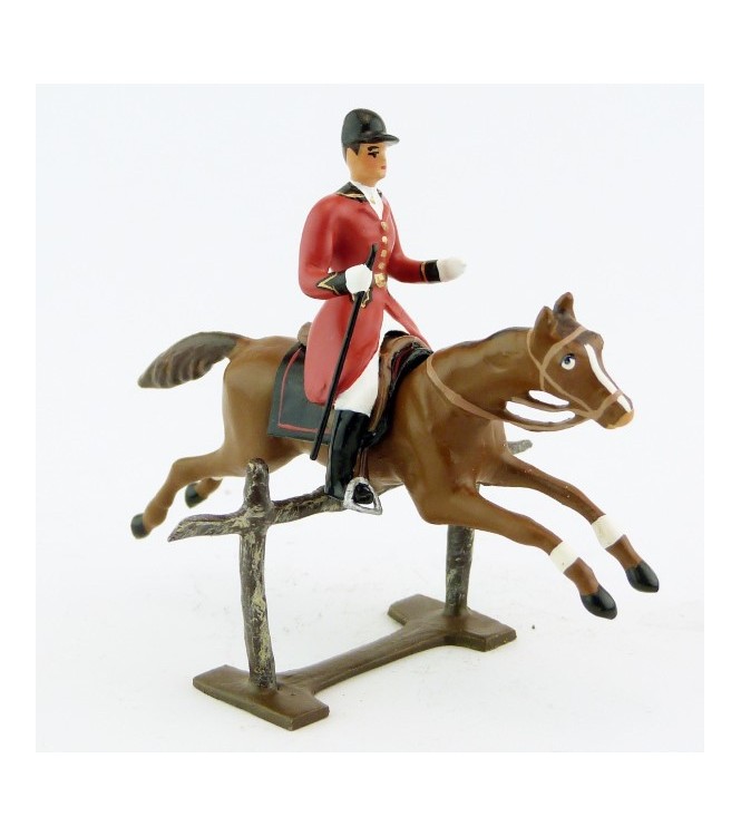 cavalier avec cravache sur cheval alezan sautant barrière