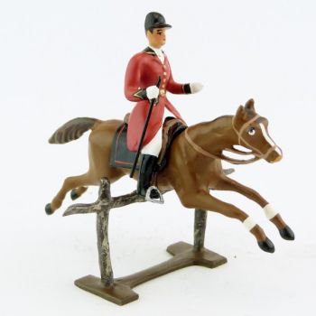 cavalier avec cravache sur cheval alezan sautant barrière