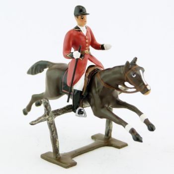 cavalier avec cravache sur cheval marron (bai) sautant barrière