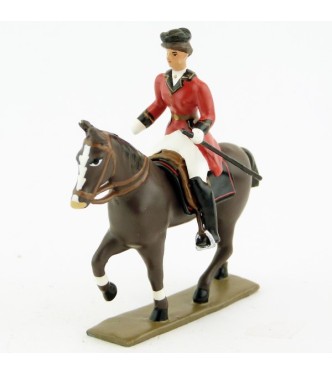 cavalière (cravache) sur cheval marron (bai) au pas