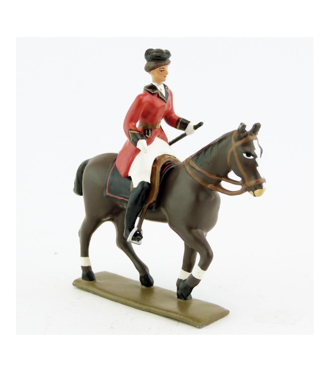 cavalière (cravache) sur cheval marron (bai) au pas