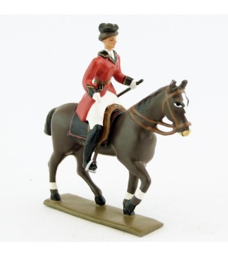 cavalière (cravache) sur cheval marron (bai) au pas