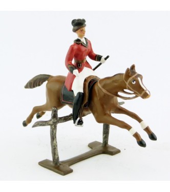 cavalière (cravache) sur cheval alezan sautant barrière