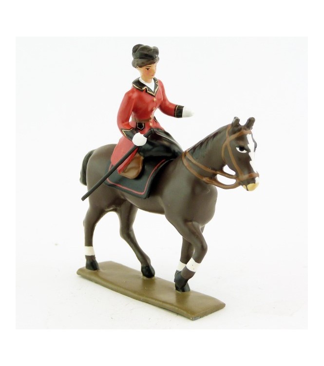 cavalière en amazone sur cheval marronn (bai) au pas