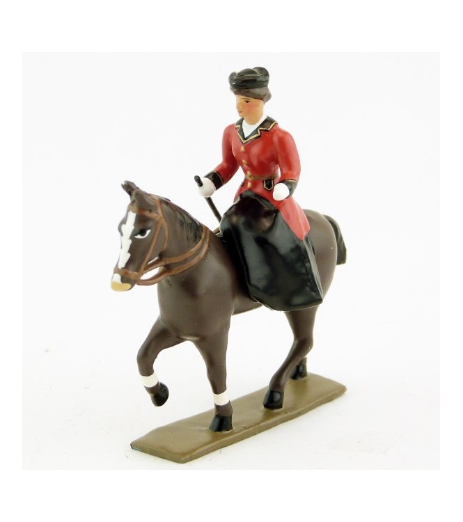 cavalière en amazone sur cheval marronn (bai) au pas