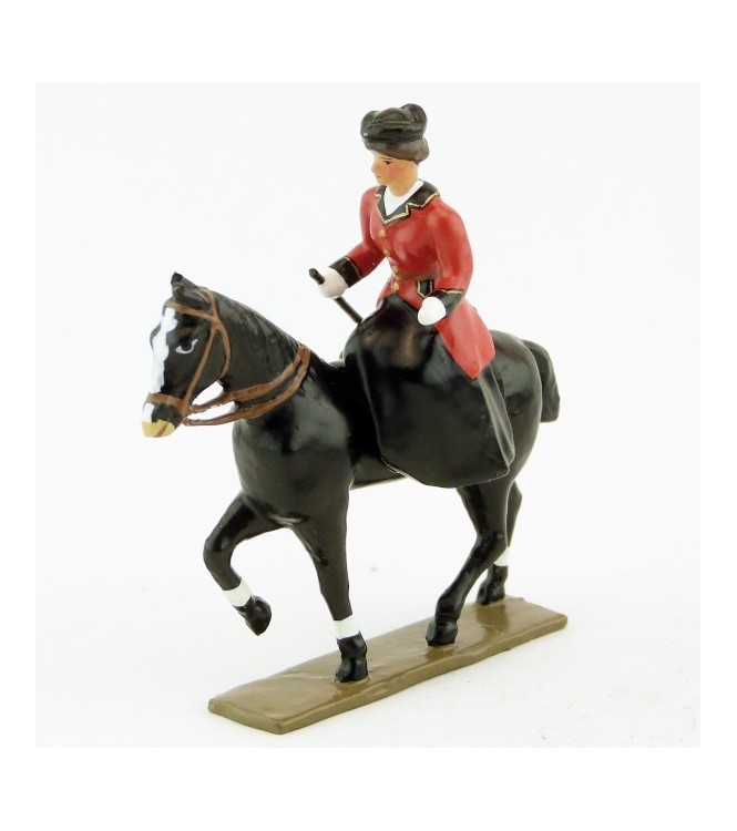 cavalière en amazone sur cheval noir au pas