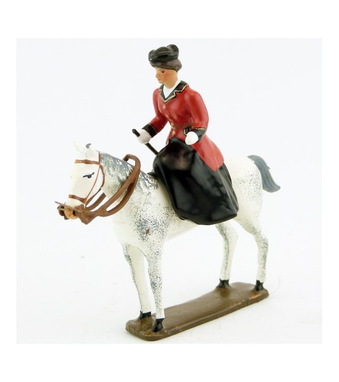 cavalière en amazone sur cheval blanc debout