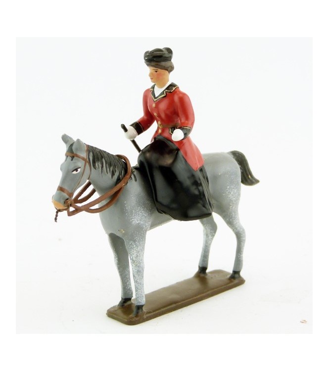 cavalière en amazone sur cheval gris debout