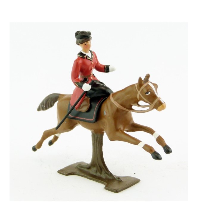 cavalière en amazone sur cheval alezan au galop (sur tronc)