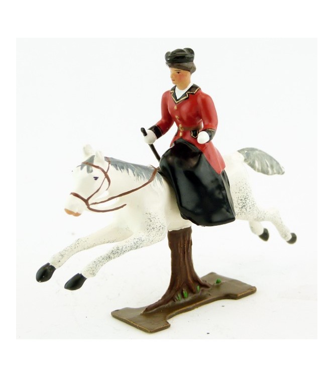 cavalière en amazone sur cheval blanc au galop (sur tronc)