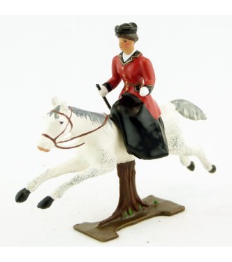 cavalière en amazone sur cheval blanc au galop (sur tronc)