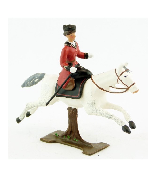 cavalière en amazone sur cheval blanc au galop (sur tronc)