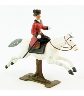 cavalière en amazone sur cheval blanc au galop (sur tronc)