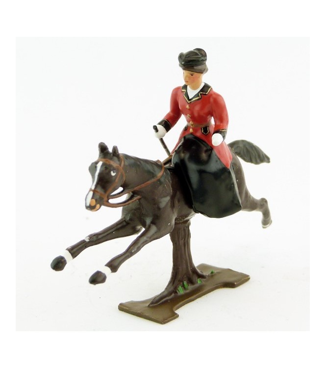 cavalière en amazone sur cheval marron (bai) au galop (sur tronc)