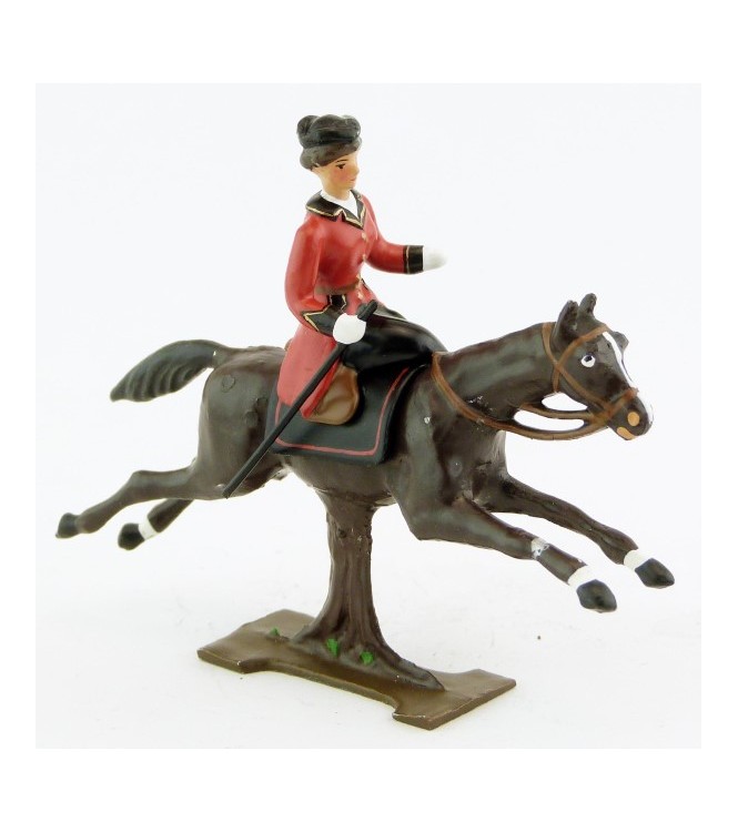 cavalière en amazone sur cheval marron (bai) au galop (sur tronc)