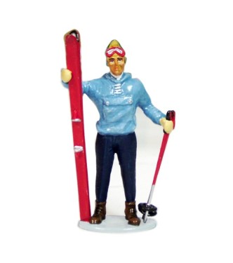 Skieur avec Skis à la main