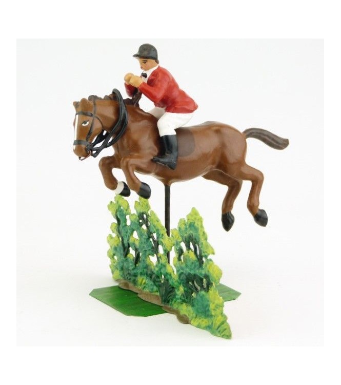 cavalier de Chasse à courre sautant un buisson