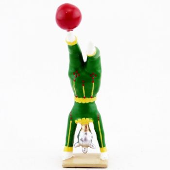 clown acrobate avec ballon en équilibre