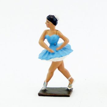 ballerine (danseuse) mains autour de la taille, en tutu bleu
