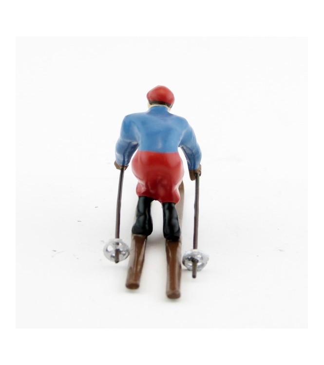 Skieur, années 20, blouson bleu et pantalon rouge