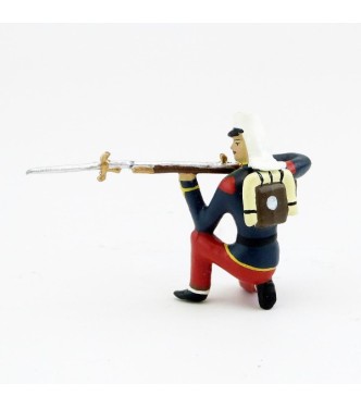 Légionnaire avec couvre-nuque à genou, fusil en joue