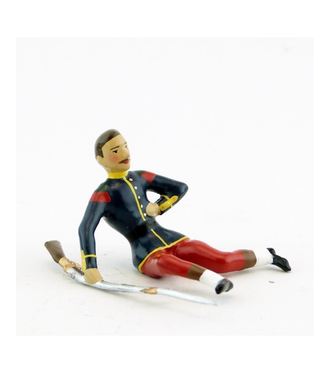 légionnaire blessé, assis au sol, main sur le cœur, avec fusil