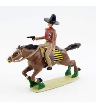 Cavalier mexicain avec revolver sur cheval au galop