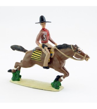 Cavalier mexicain avec revolver sur cheval au galop