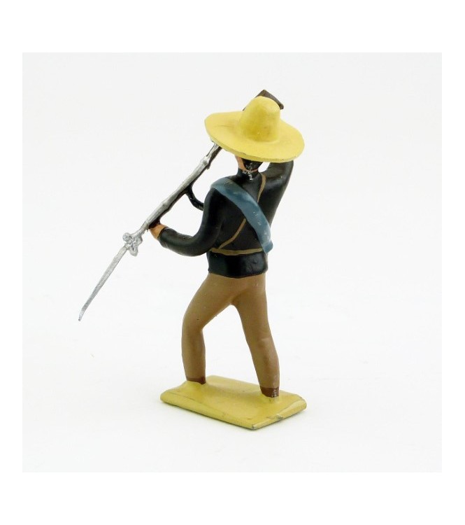 Mexicain pointant son fusil vers le sol