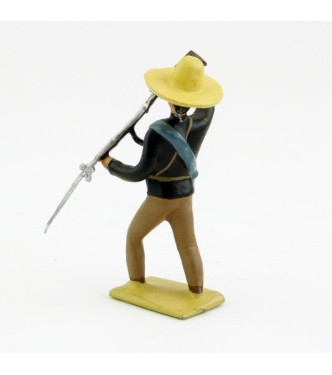 Mexicain pointant son fusil vers le sol