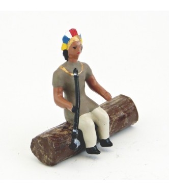 indien assis sur tronc d'arbre avec calumet