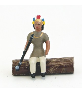 indien assis sur tronc d'arbre avec calumet