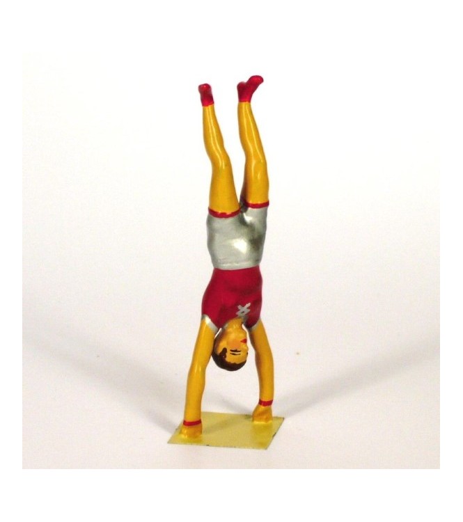 équilibriste faisant le poirier